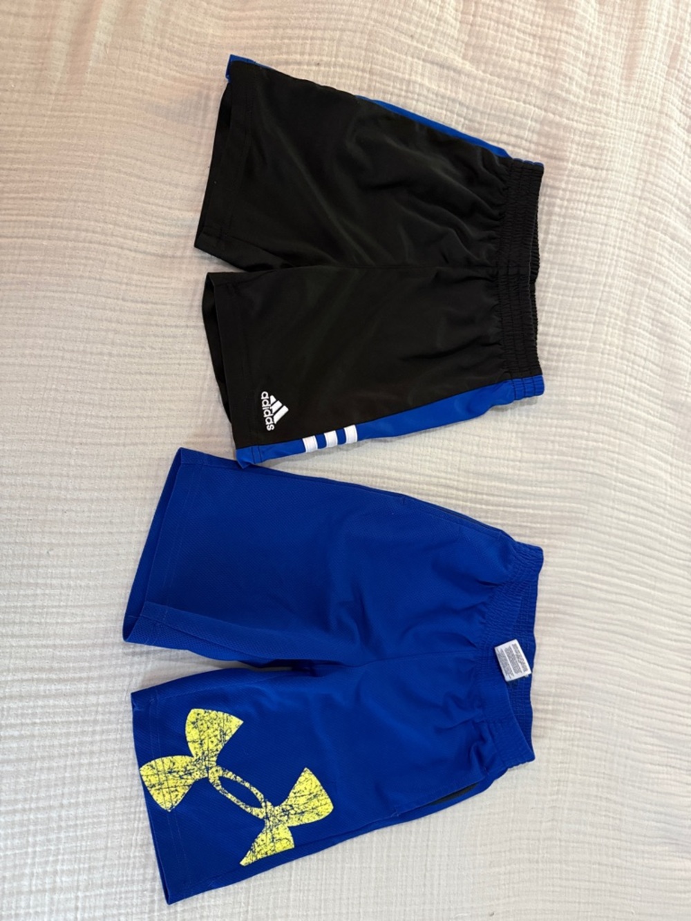 Two boys shorts. Athletic shorts. Size 4 and four. Adidas & under Armour brands.